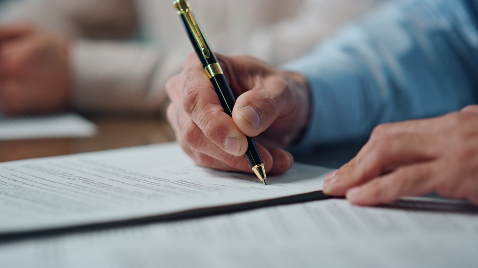 Closeup ceo hands signing contract office. Unknown man writing pen signature